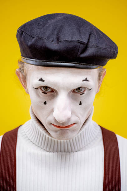istock Portrait of a pantomime on the yellow background 1138418042
