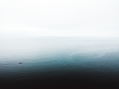 Drone photo of foggy blue cold sea in Norway