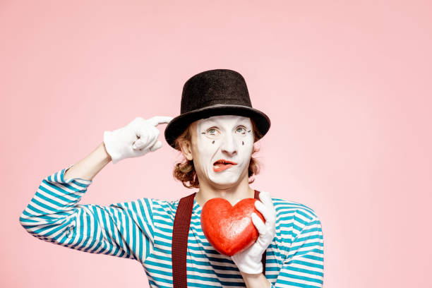 istock Pantomime with red heart on the pink background 1138420378