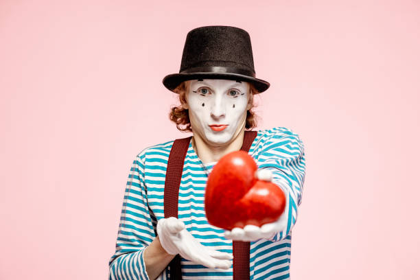 istock Pantomime with red heart on the pink background 1138420469