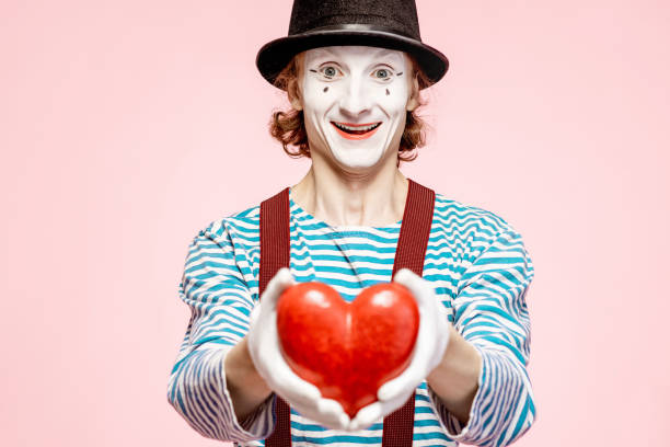 istock Pantomime with red heart on the pink background 1138420531