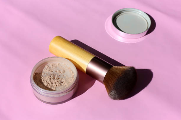 istock Loose Powder and Powder Brush on a Pink Surface 1138421362