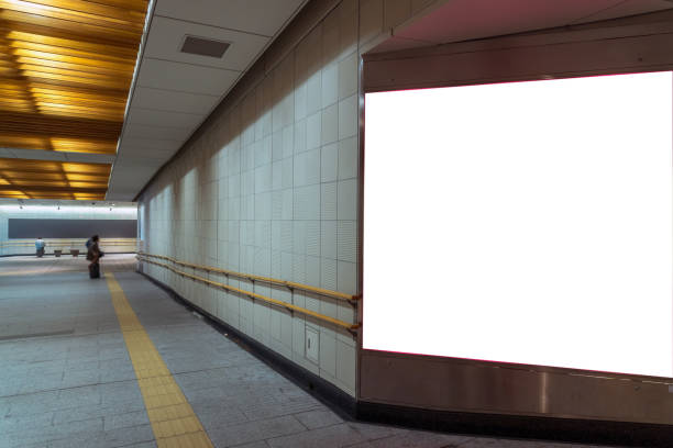 istock Walkway with Blank billboard located in underground hall or subway for advertising, mockup concept, Low light speed shutter 1138421784