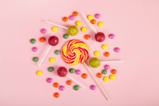 istock Colorful lollipops and different colored round candy. Top view. 1138422353