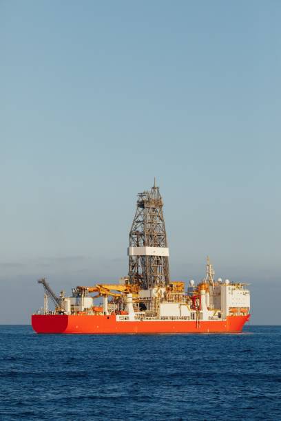 istock offshore oil and gas drillship, blue ocean background 1138423367