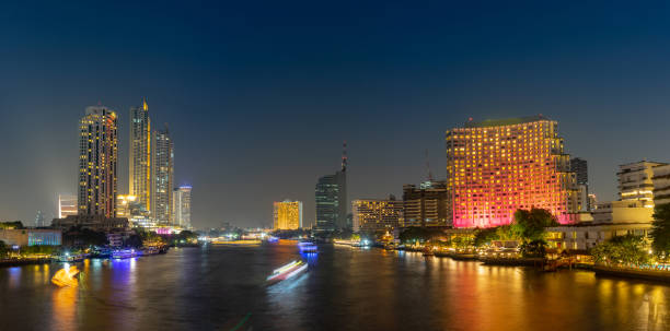 istock Cityscape river front with long exposure light on the bridge. Bangkok, Thailand. Panorama. 1138424871