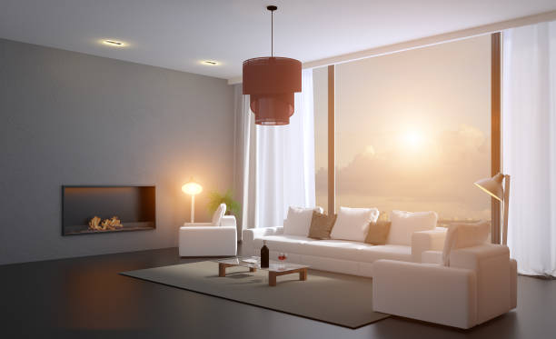 istock A room with a fireplace and a large white sofa on the background of panoramic windows.. 3D rendering. Sunset 1138425083