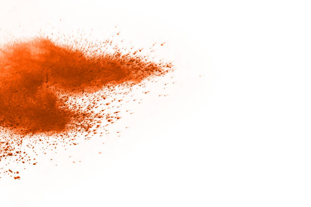 istock abstract orange powder splatted background,Freeze motion of color powder exploding/throwing color powder,color glitter texture on white background. 1138425146