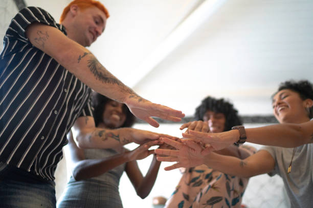 istock Friends dancing and putting hands together for unity at kitchen 1138425247