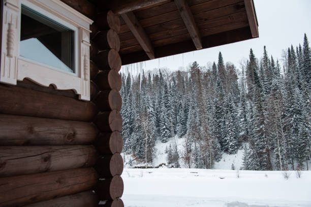 istock Winter holiday house in forest. 1138428983