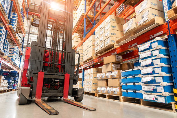 Forklift truck loader. Forklift truck loader. Huge distribution warehouse with high shelves background. pallet industrial equipment photos stock pictures, royalty-free photos & images