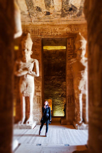 istock Abu Simbel - Traveller inside Temple in Egypt Between  statues 1138430342