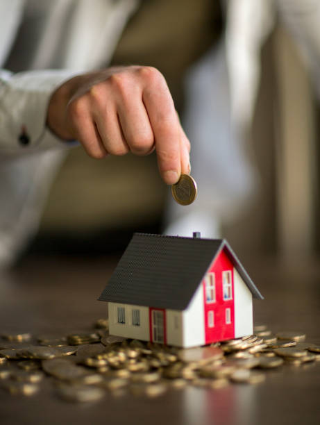 istock Real Estate Agent with house model and saving concepts 1138430957