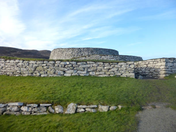 Clickimin Broch, Lerwick, Shetland Islands, Scotland The Broch of Clickimin (also Clickimin Broch) is a large, well-preserved but restored broch in Lerwick in Shetland, Scotland. Originally built on an island in Clickimin Loch, it was approached by a stone causeway. The broch is situated within a walled enclosure and, unusually for brochs, features a large "forework" or "blockhouse" between the opening in the enclosure and the broch itself. A broch is an Iron Age(or Bronze age) drystone hollow-walled structure found in Scotland. Brochs belong to the classification "complex atlantic roundhouse". broch of clickimin stock pictures, royalty-free photos & images