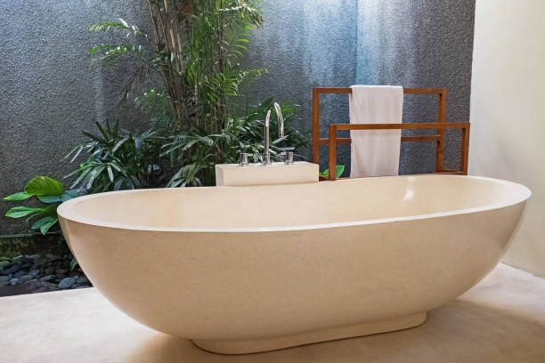 istock Luxury bathroom with stone bathtub and open space concept in a modern house 1138434688