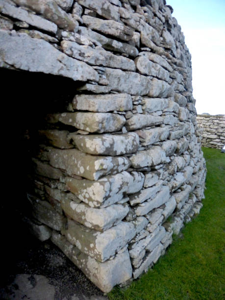 Doorway into Clickimin Broch, Lerwick, Shetland Islands, Scotland The Broch of Clickimin (also Clickimin Broch) is a large, well-preserved but restored broch in Lerwick in Shetland, Scotland. Originally built on an island in Clickimin Loch, it was approached by a stone causeway. The broch is situated within a walled enclosure and, unusually for brochs, features a large "forework" or "blockhouse" between the opening in the enclosure and the broch itself. broch of clickimin stock pictures, royalty-free photos & images