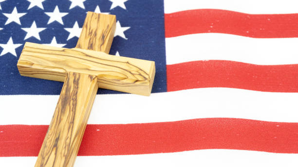 istock Wooden Cross on American Flag 1138435314