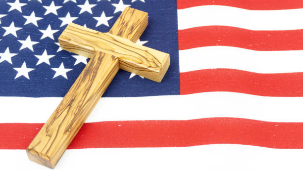 istock Wooden Cross on American Flag 1138435354