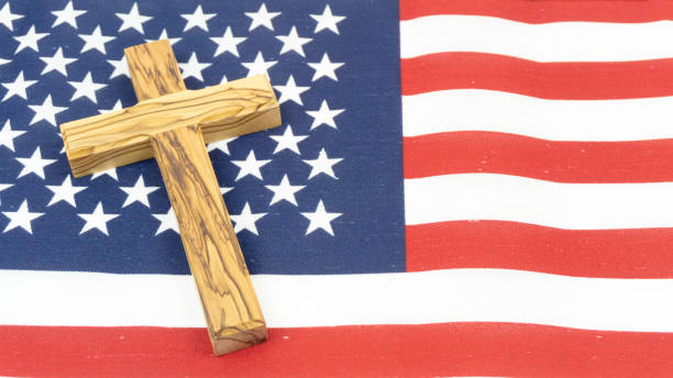 istock Wooden Cross on American Flag 1138435361