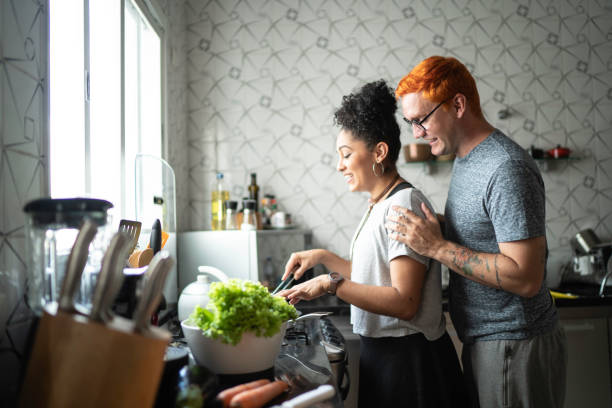 istock Couple cooking together at home 1138436595