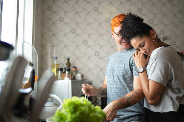 istock Couple cooking together at home 1138436716