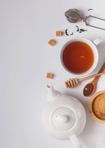 istock Cup, teapot and sugar on the white background, top view 1138438624