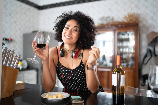 istock Woman portrait drinking wine at home 1138439919
