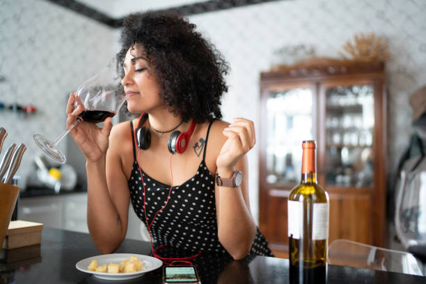 Woman drinking wine at home