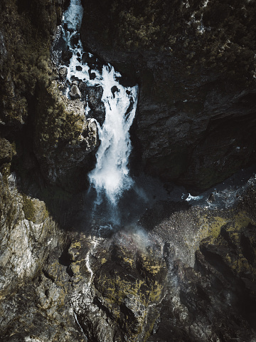Drone photo of Voringfossen waterfall in big green canyon in Norway