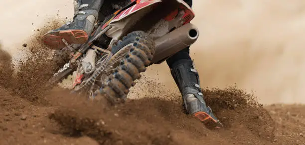 Rider driving in the motocross race the rear wheel motocross bike