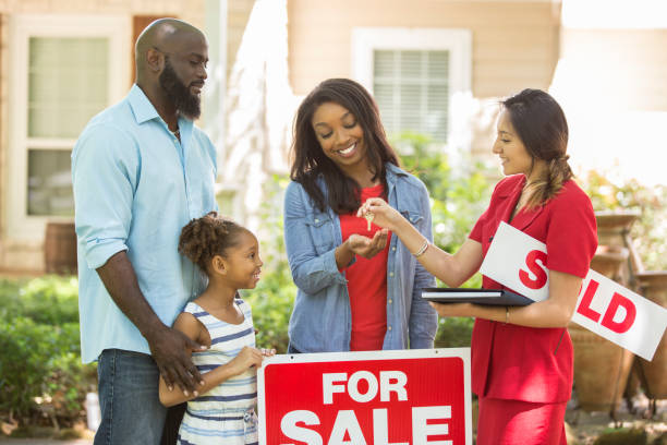 real estate agent and family looking at new home to purchase. - spring happiness women latin american and hispanic ethnicity imagens e fotografias de stock