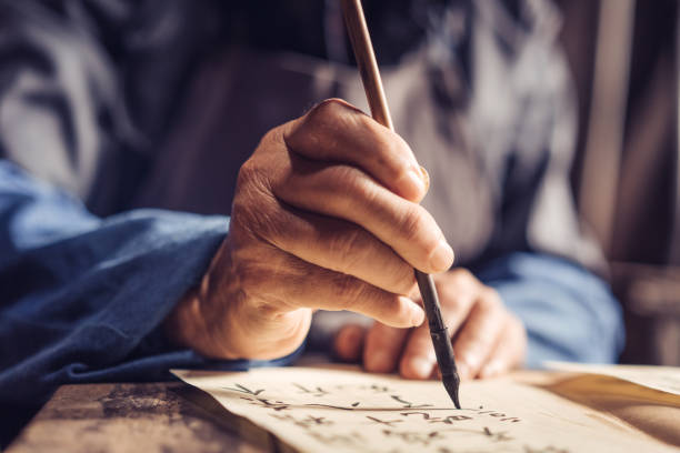 istock Chinese senior man writing chinese calligraphy 1138444344