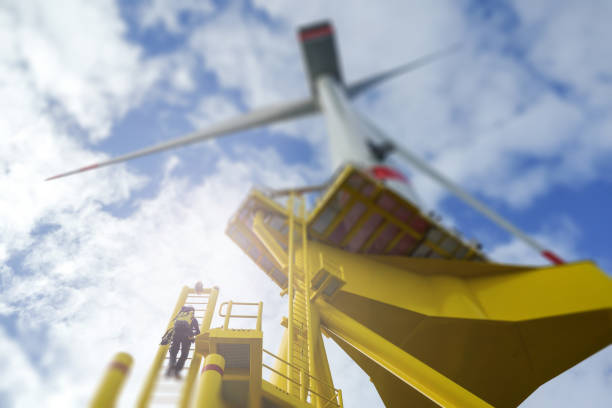 istock Manual high worker offshore climbing on wind-turbine on ladder 1138444717