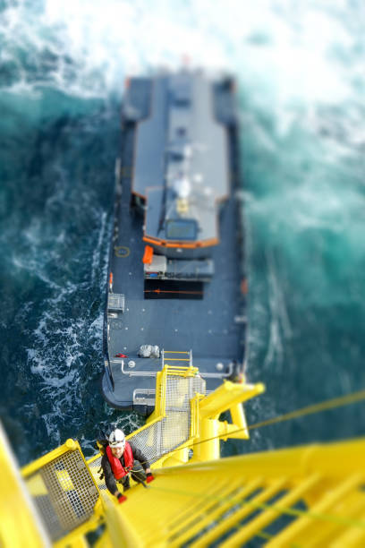 istock Rope access technician climbing on the tower - antenna with hooks and looking on camera 1138444722