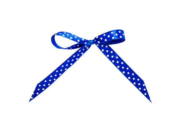 istock Blue satin bow with polka dots. Ribbon isolated on white background. 1138445114