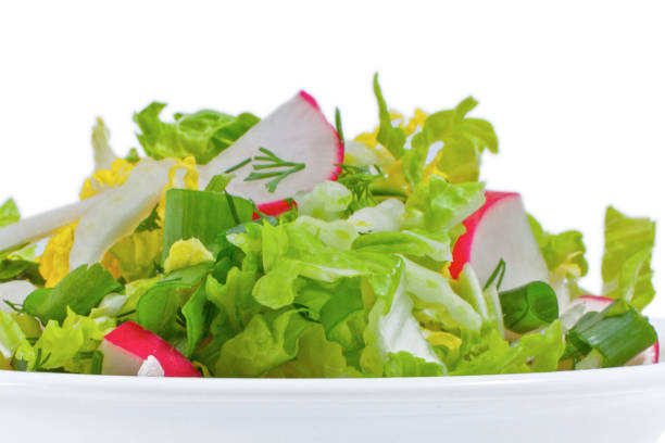 Fresh vegetable salad  in plate, isolated