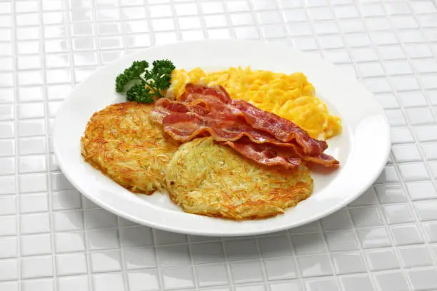 diner style hash browns, scrambled eggs and bacon