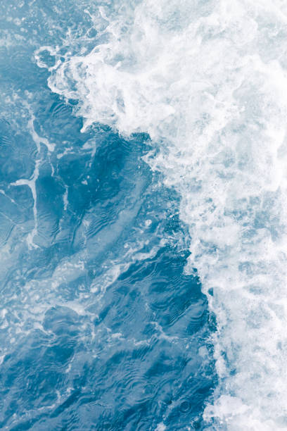 istock Pale blue sea wave during high summer tide, abstract ocean background 1138450496