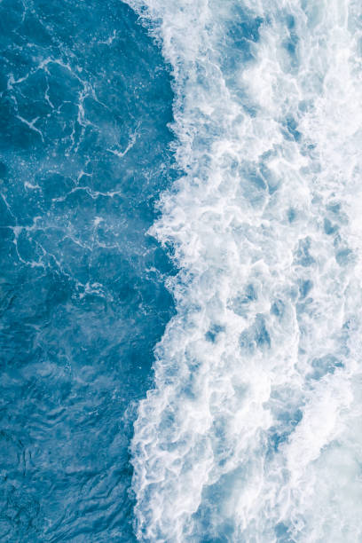 istock Pale blue sea wave during high summer tide, abstract ocean background 1138450502