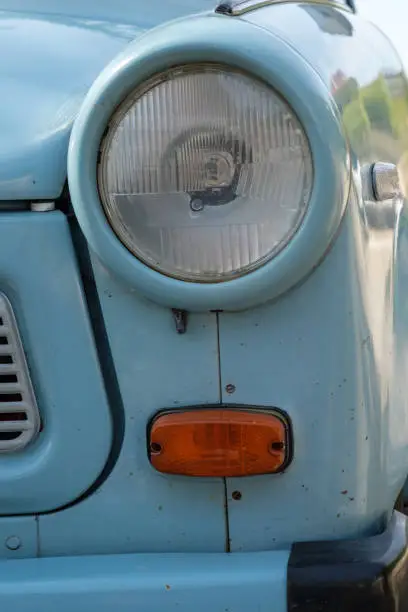 Blue trabant car headlight in vertical format