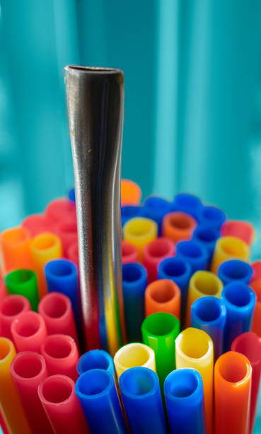 istock Stainless reusable straw against plastic straws with turquoise background. Say no to plastic 1138452388