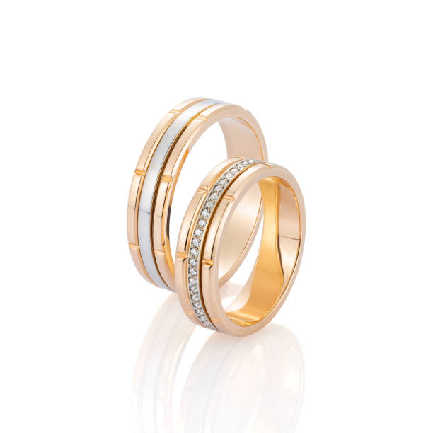 istock Pair of gold wedding ring with diamonds isolated on white background 1138454815
