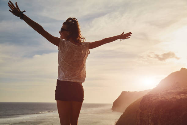 istock Tourist girl with backpack enjoying the view. 1138456874