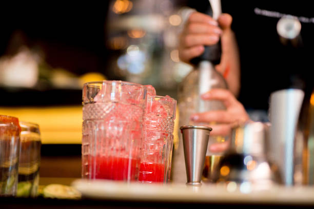 istock female bartender preparing cocktail in a cocktail bar 1138457980