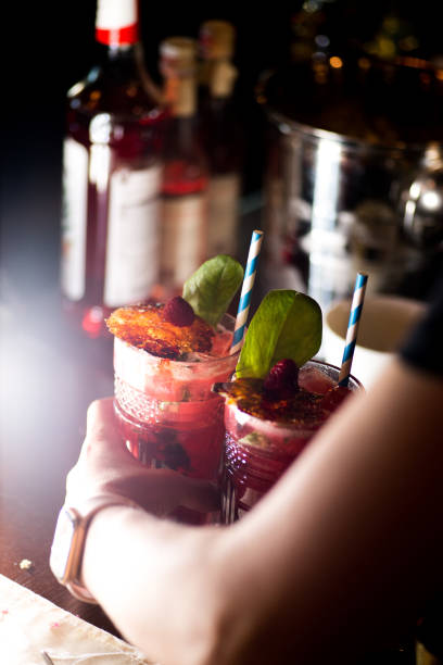istock female bartender preparing cocktail in a cocktail bar 1138457982