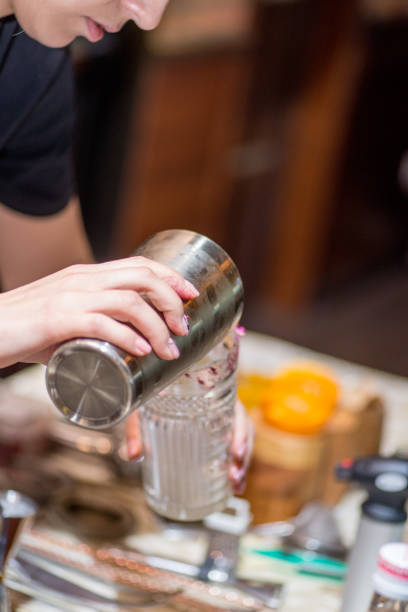 istock female bartender preparing cocktail in a cocktail bar 1138457987