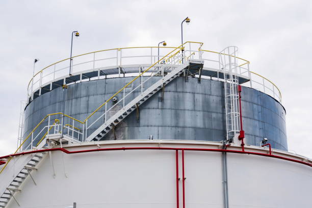 liquid and fluid gas or oil storage tank, holder, container, dramatic sky background copy space - oil storage tank storage compartment fuel and power generation imagens e fotografias de stock