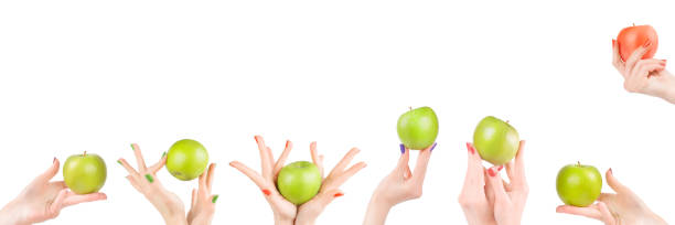 istock Woman hands with apples set isolated with clipping path 1138459353