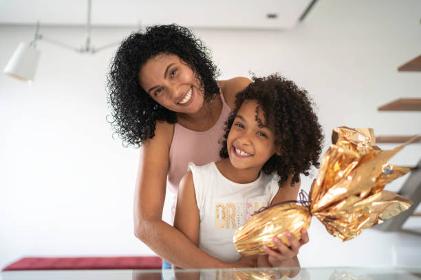 Mother and daughter celebrating easter at home portrait