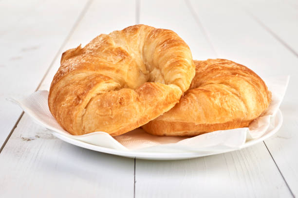 istock Croissants on wooden table 1138462136
